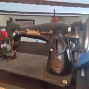 Antique cardinal sewing machine